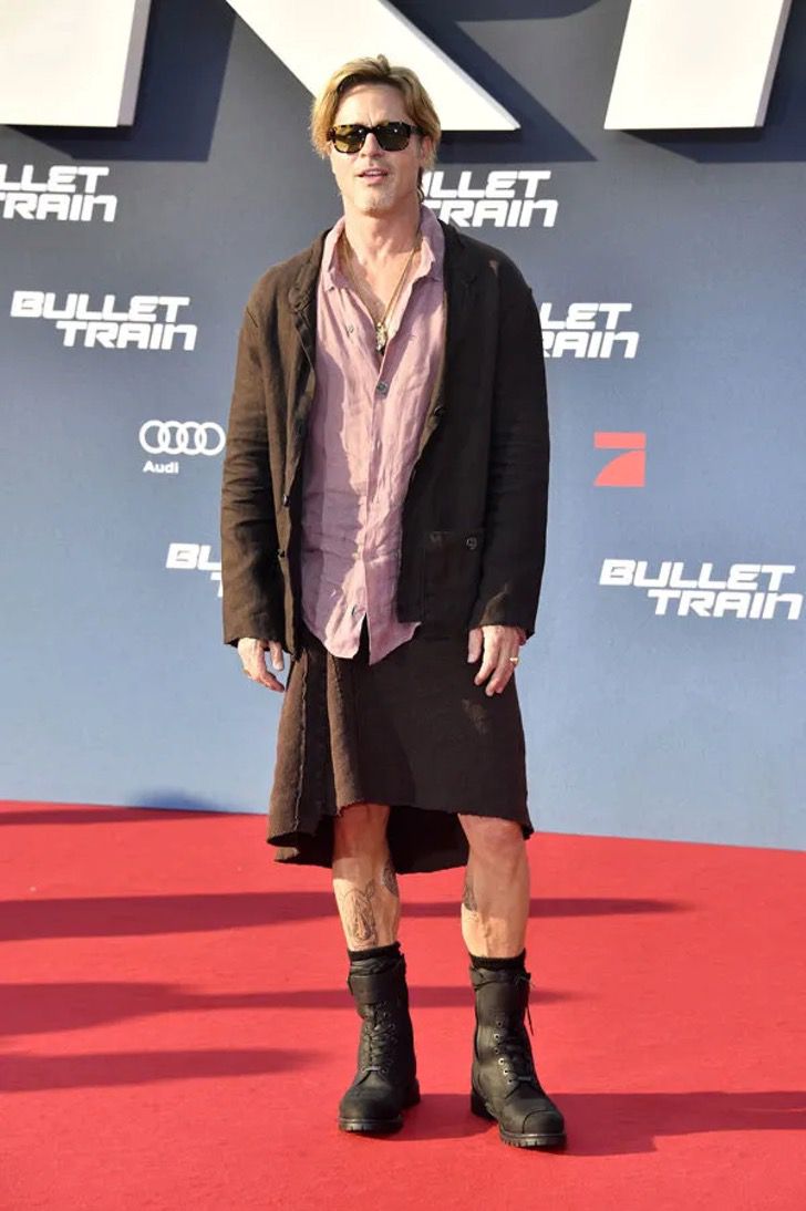 agrandeartedeserfeliz.com - Brad Pitt surpreendeu ao chegar à estreia de saia e camisa rosa